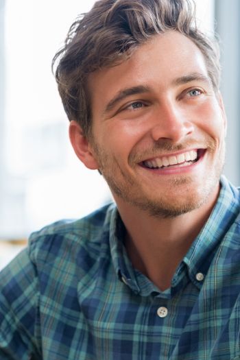 Young man in a light blue plaid shirt